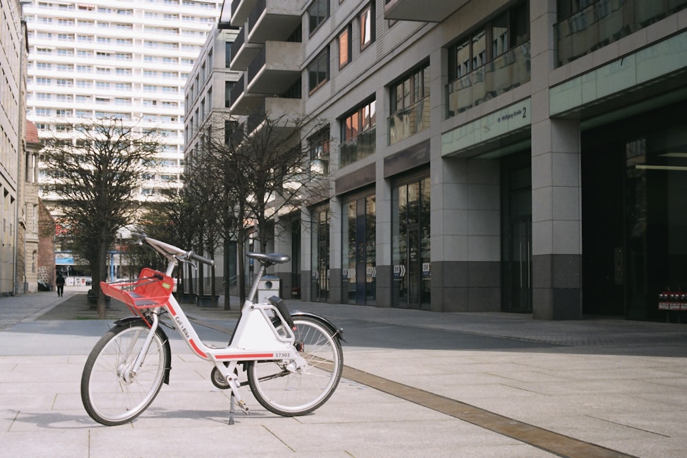 a bicycle parked on a sidewalk