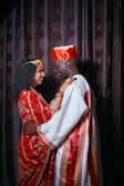 a man and woman in traditional indian attire