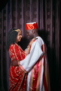 a man and woman in traditional indian attire