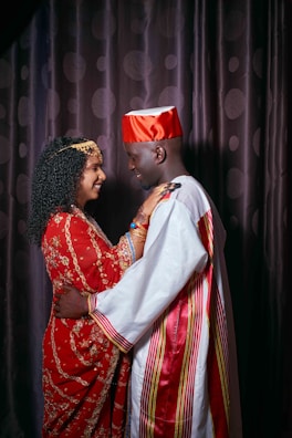 a man and woman in traditional indian attire