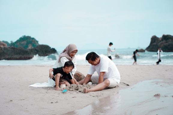 a group of people playing on a beach