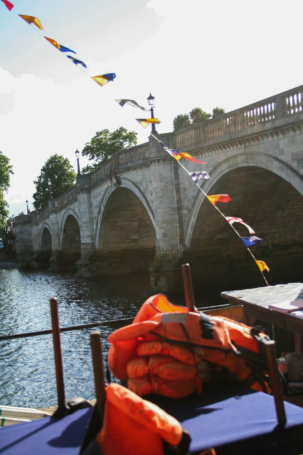 a bridge with flags