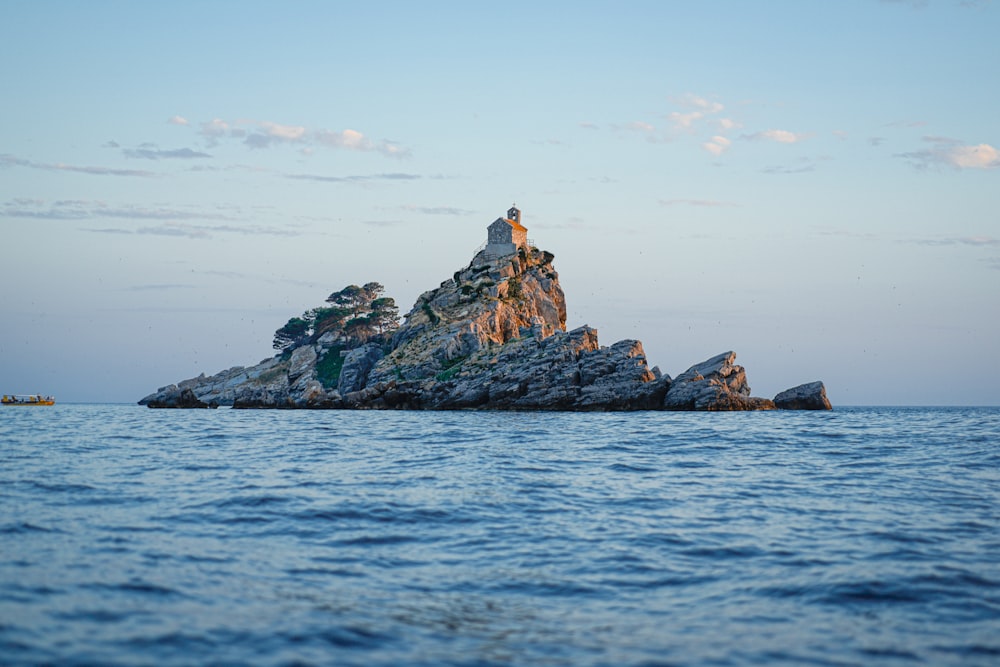 a rocky island with a boat