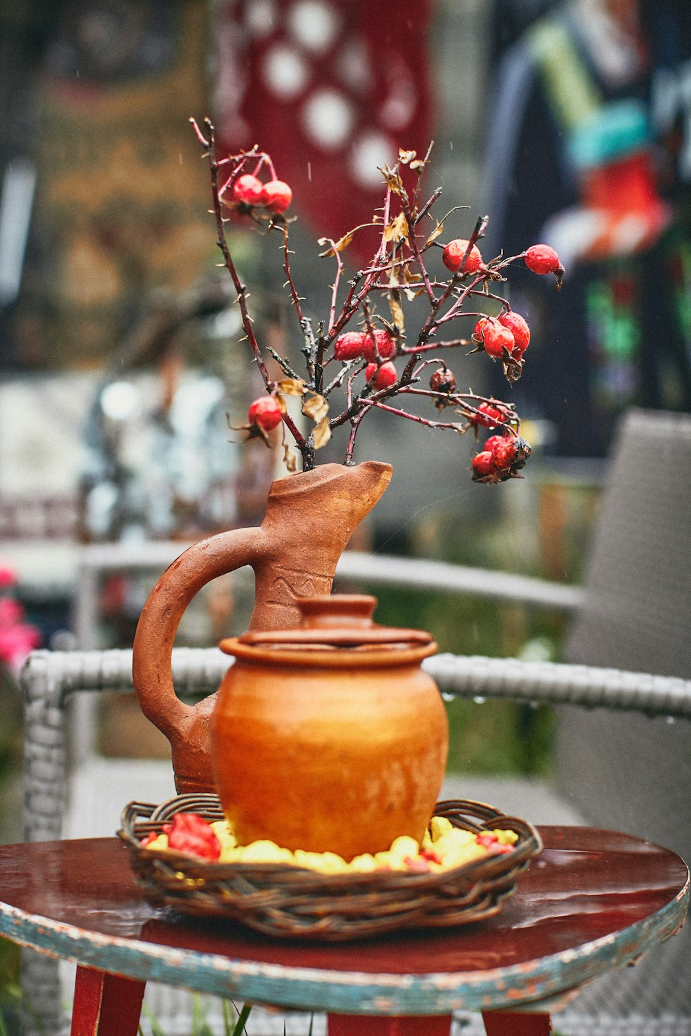 a teapot with flowers in it