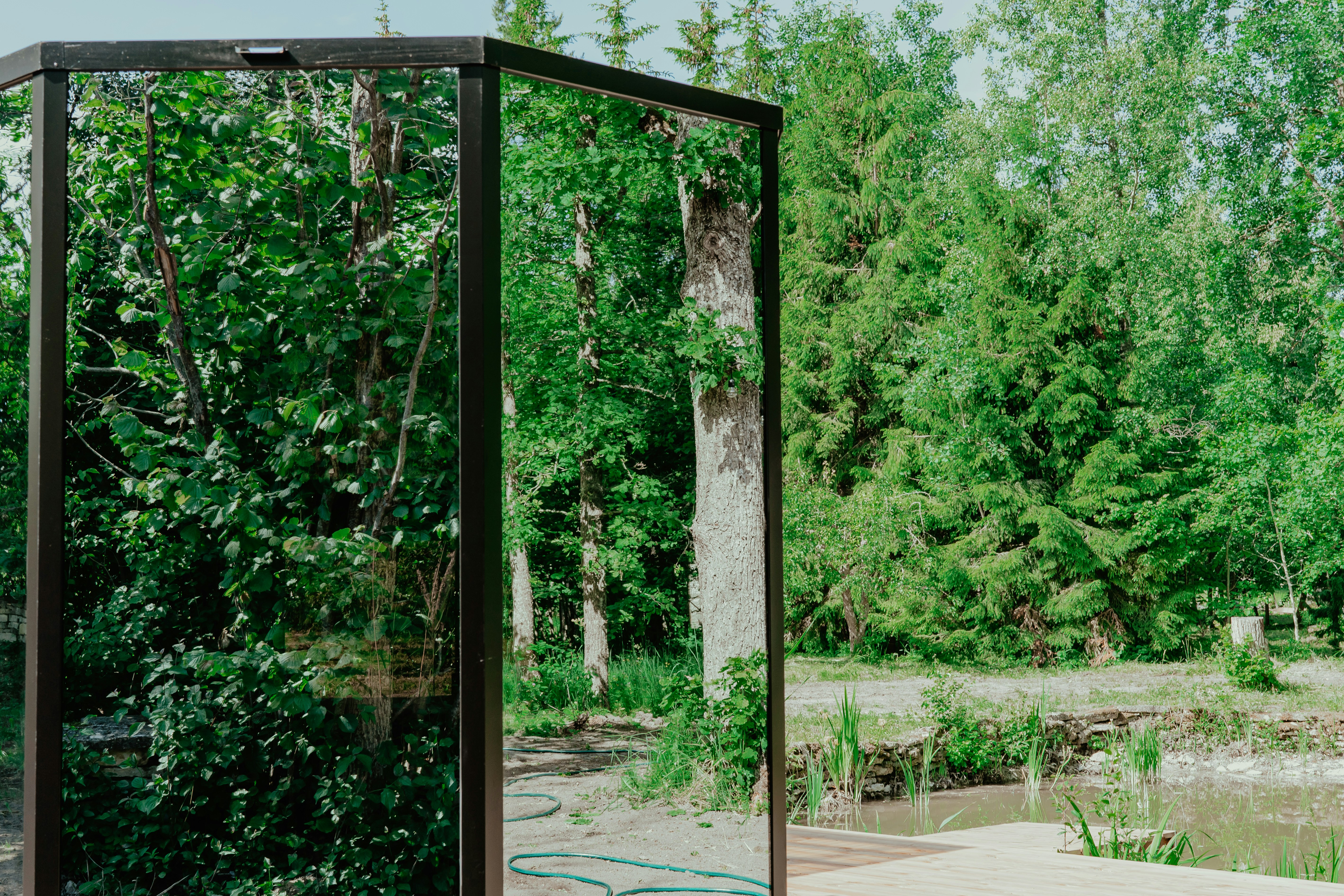 a wooden gate with trees in the background