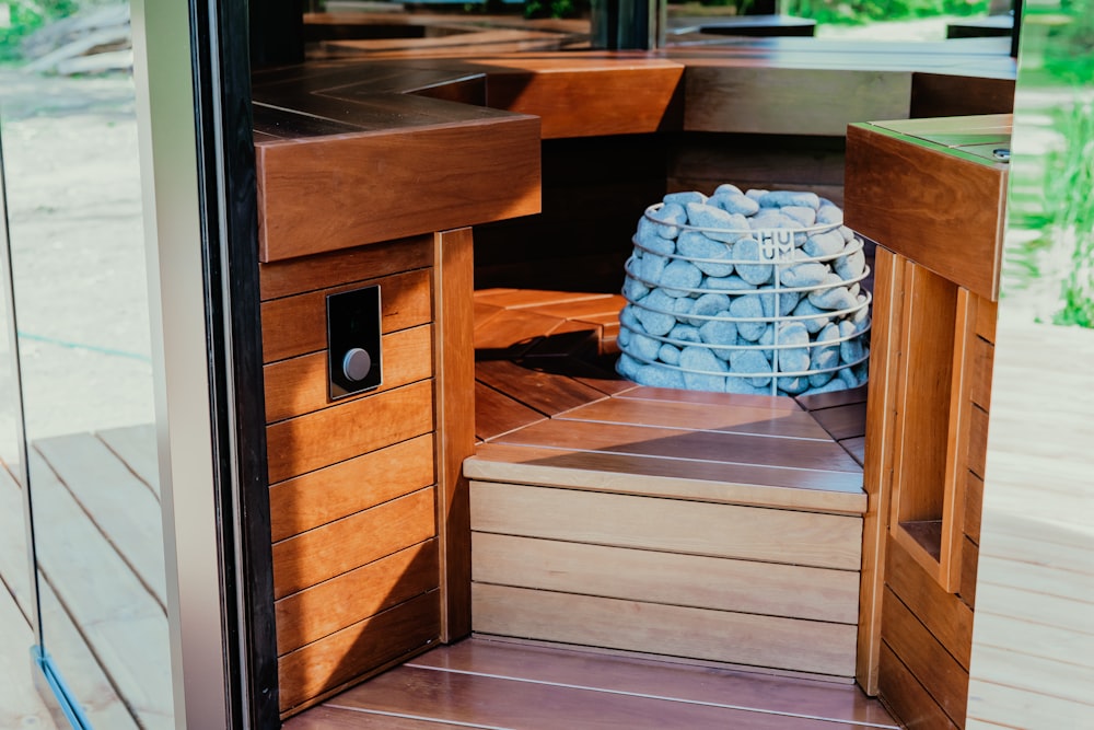 a wood cabinet with a glass door