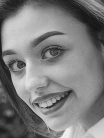 Close-up of a perfectly aligned passport photo showing correct lighting and background.