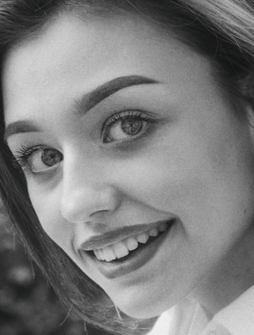 Close-up of a perfectly aligned passport photo showing correct lighting and background.