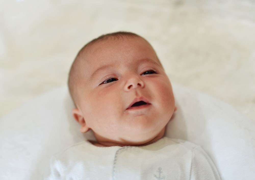 a baby with a white shirt