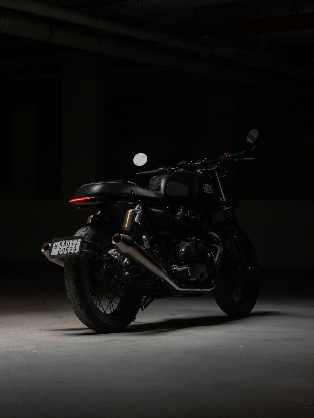 a motorcycle parked in a dark room