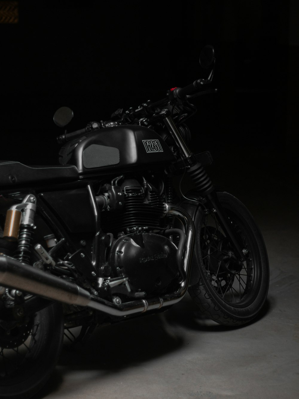 a black motorcycle with a black background