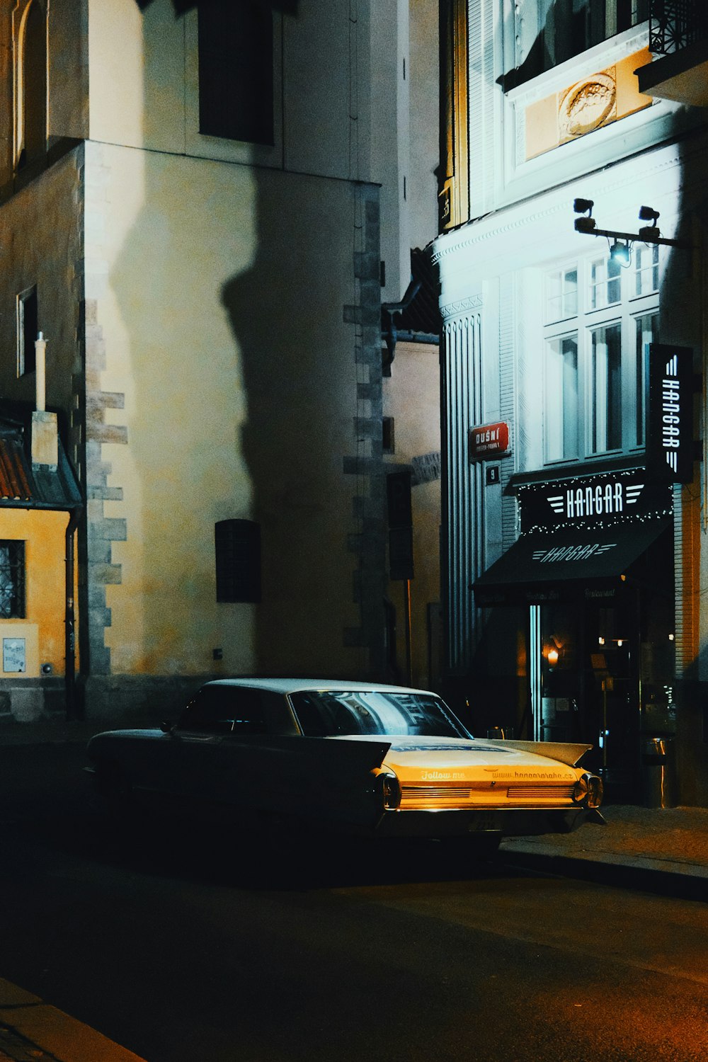 a taxi driving down a street