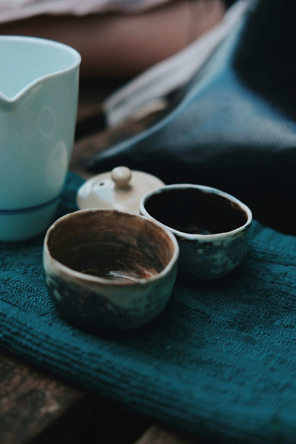 a group of small cups with brown liquid in them