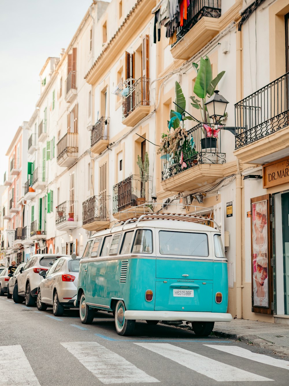 a row of cars parked on the side of a street