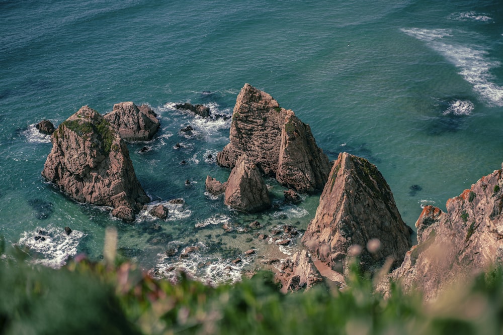 a group of rocks in the water