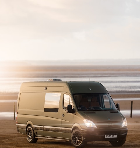 a van parked on a beach