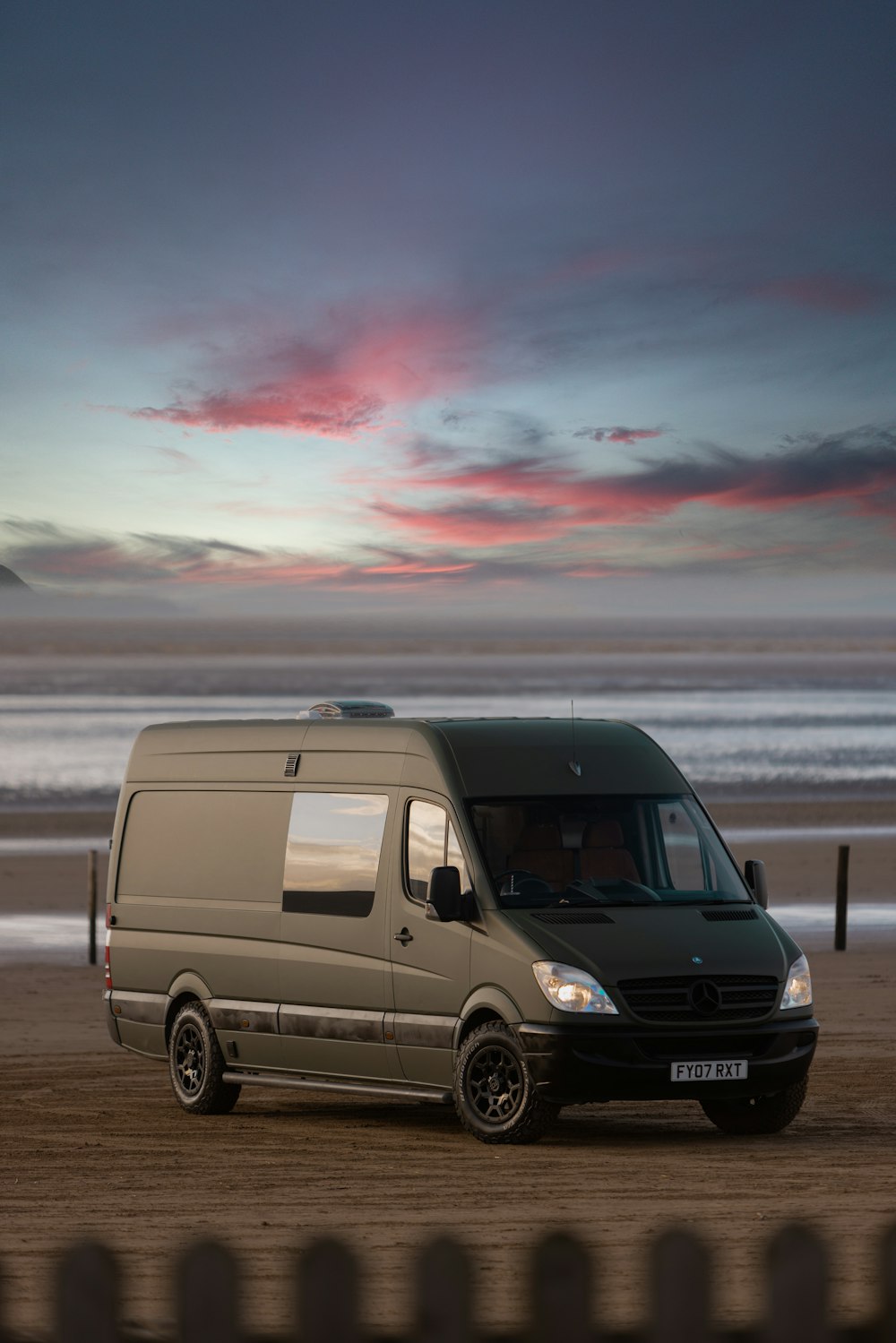 a van parked on a beach