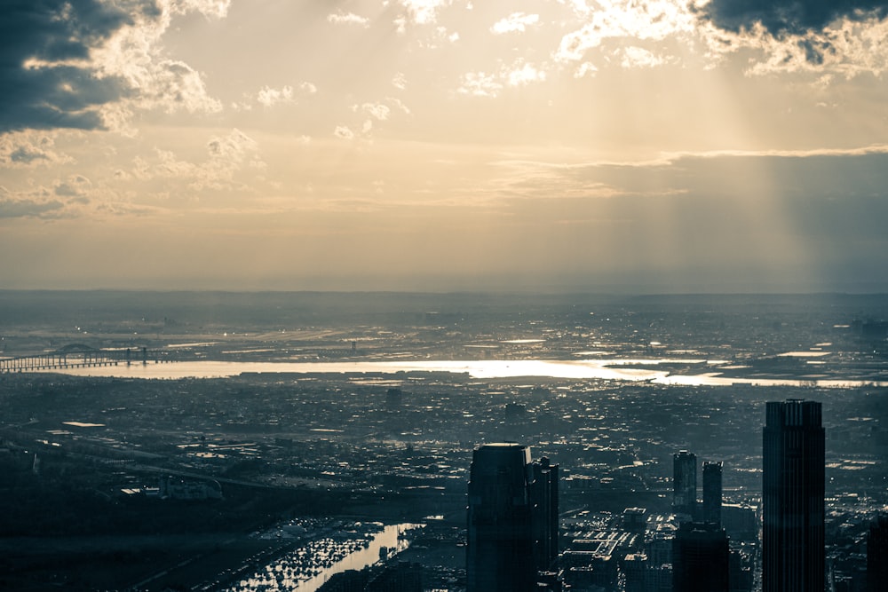 a city with a body of water in the background