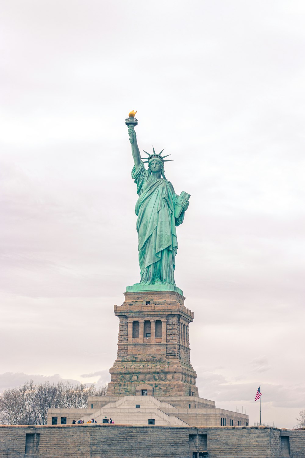 a statue of a person holding a torch