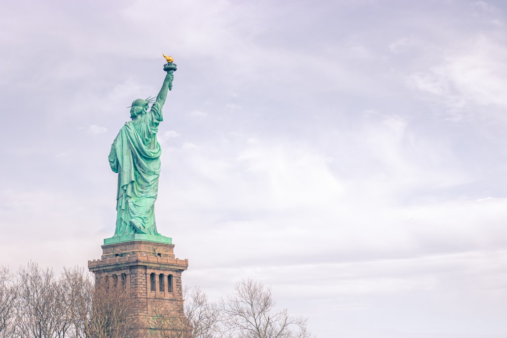 a statue of a person holding a torch