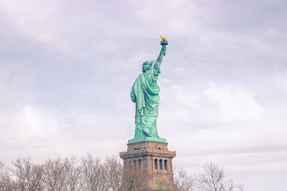 a statue of a person holding a torch