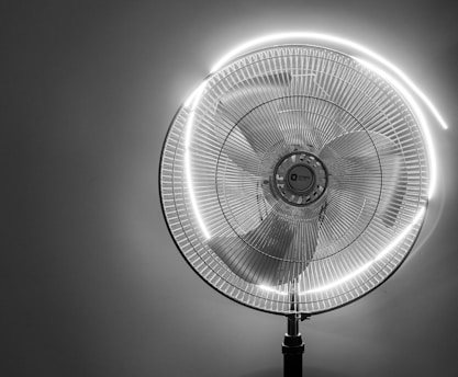 a large fan with a light