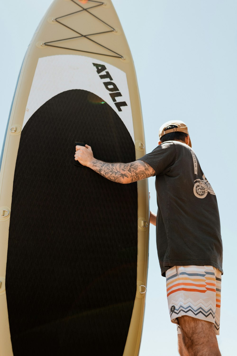 a man holding a surfboard