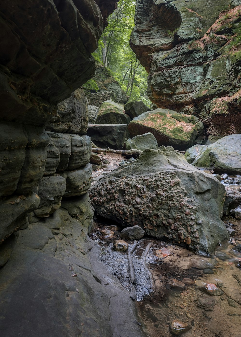 a rocky area with a stream running through it