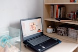 A neat workspace with a laptop displaying veterinary course materials