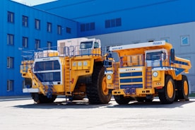 a few construction vehicles parked outside a building