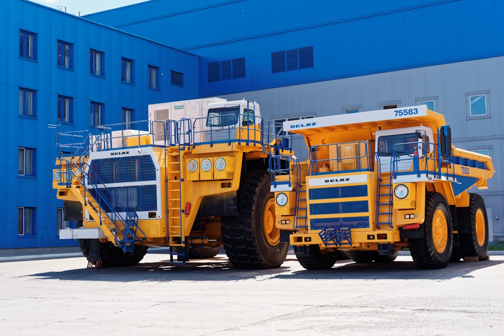a few construction vehicles parked outside a building