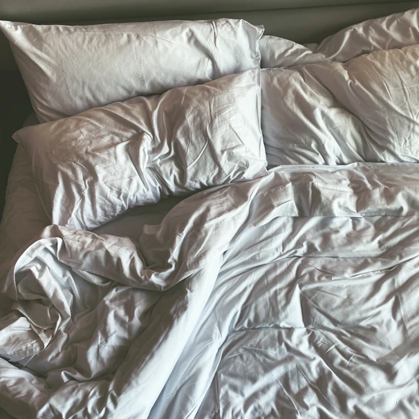 a bed with a white sheet