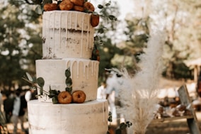 a white cake with fruit on top