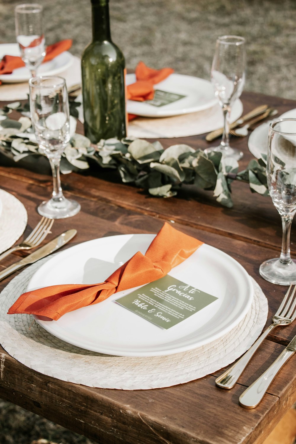 a table with plates and glasses