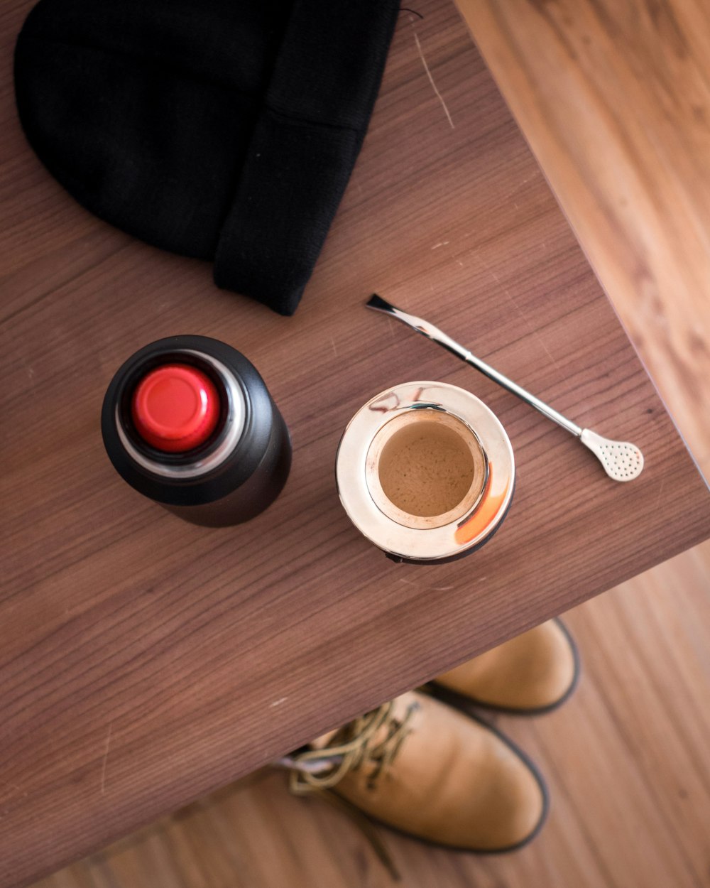 a set of rings and a red light on a wooden surface