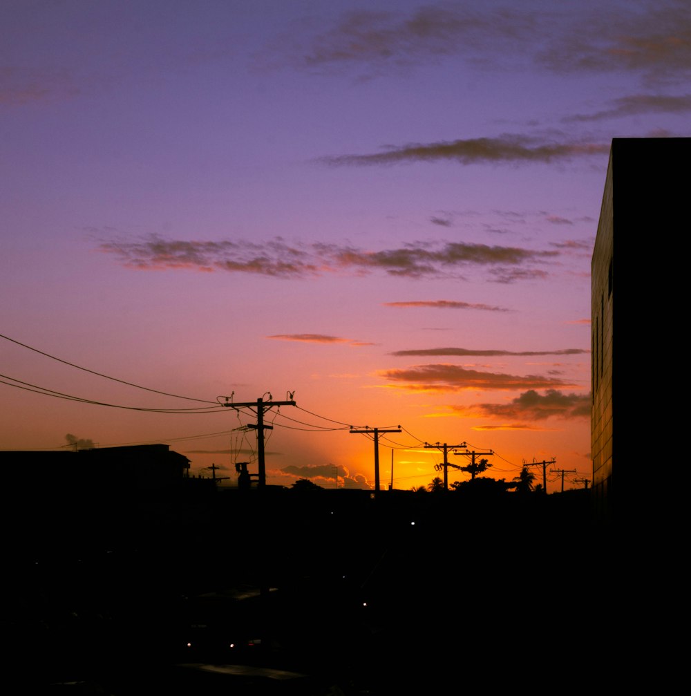 a sunset over power lines