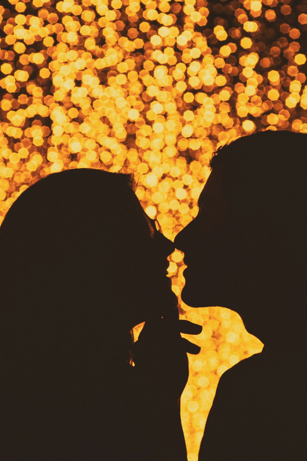a pair of people kissing