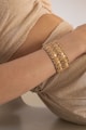 a person wearing a gold bracelet