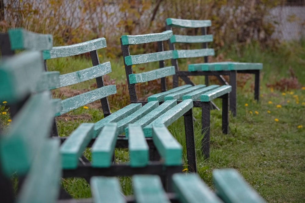 a row of green benches