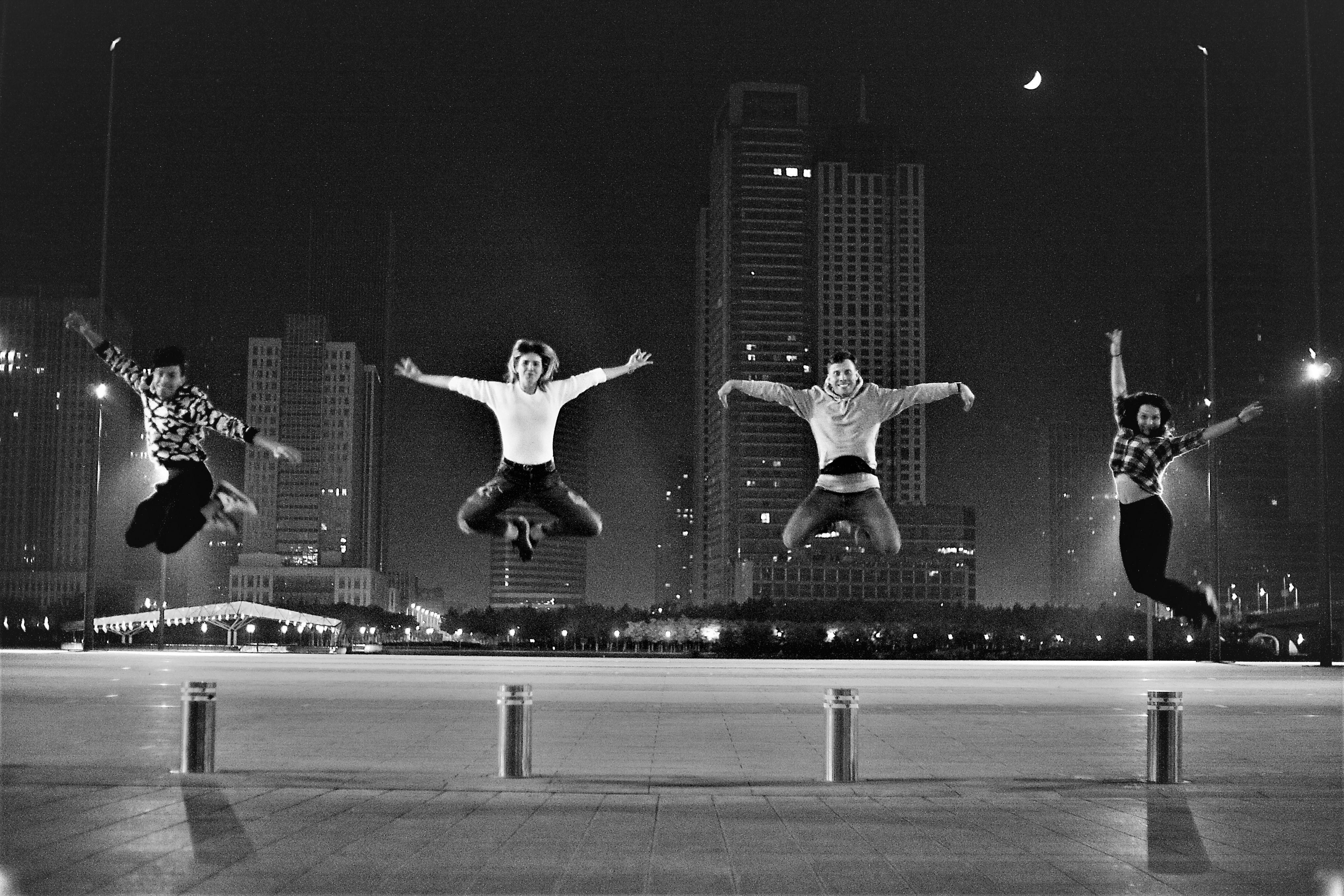 a group of people jumping in the air