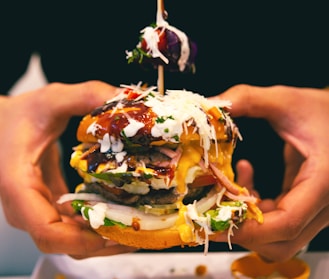 a person holding a burger