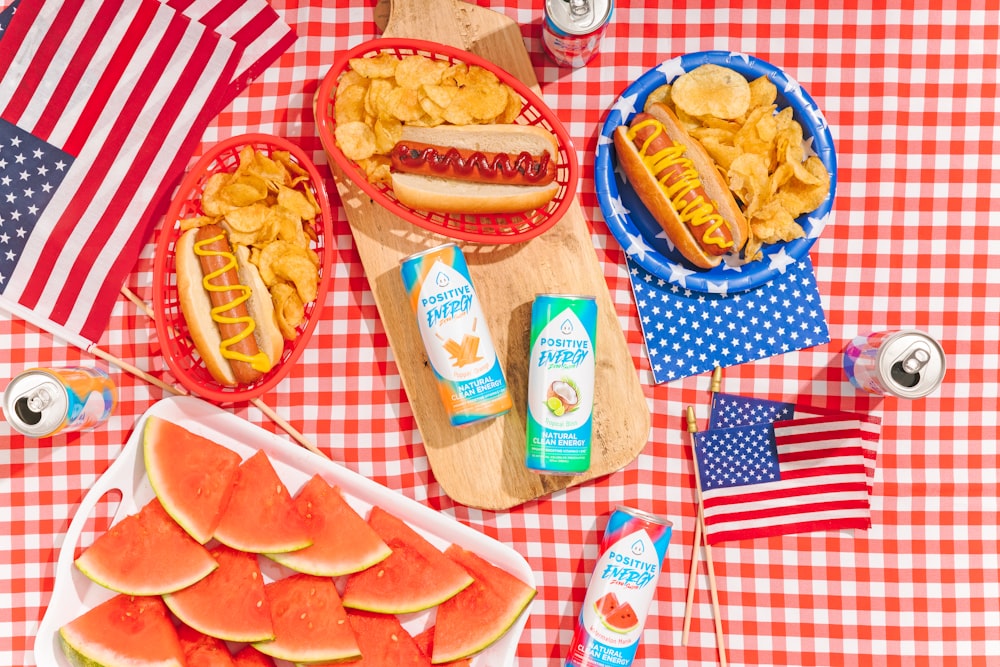 hot dogs and snacks on a table