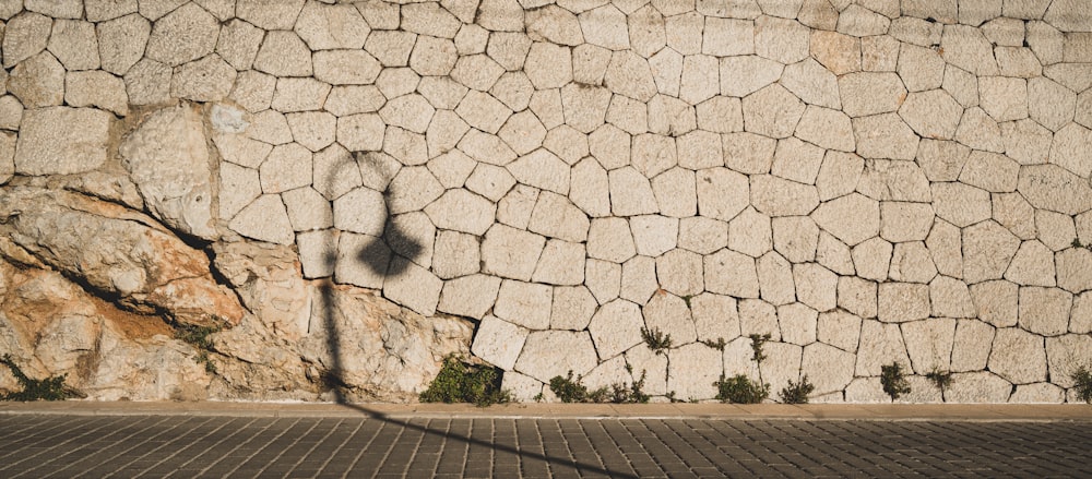 a stone wall with a rock wall