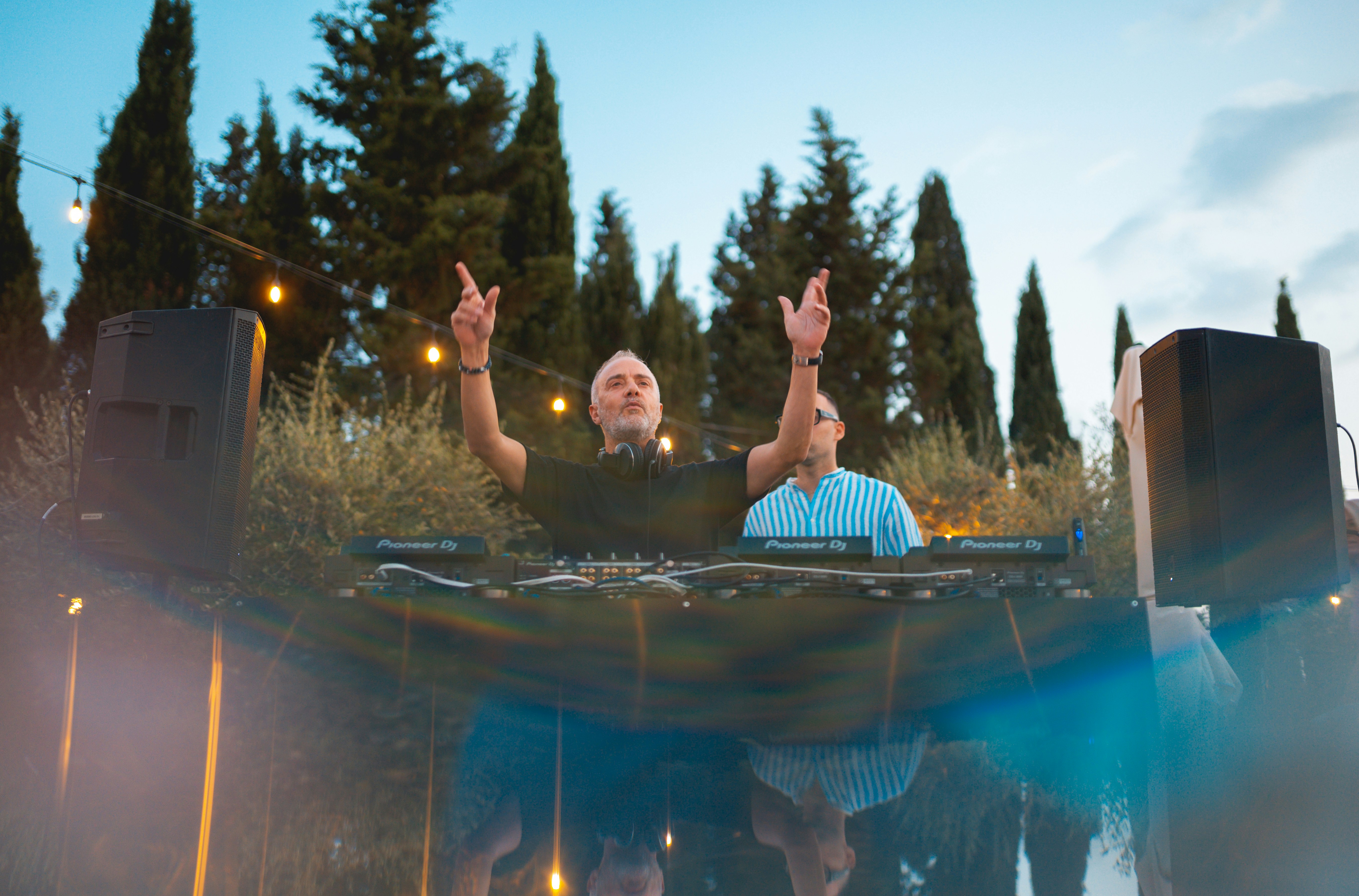 A couple of men in a pool with their hands up photo – Free Grey Image ...
