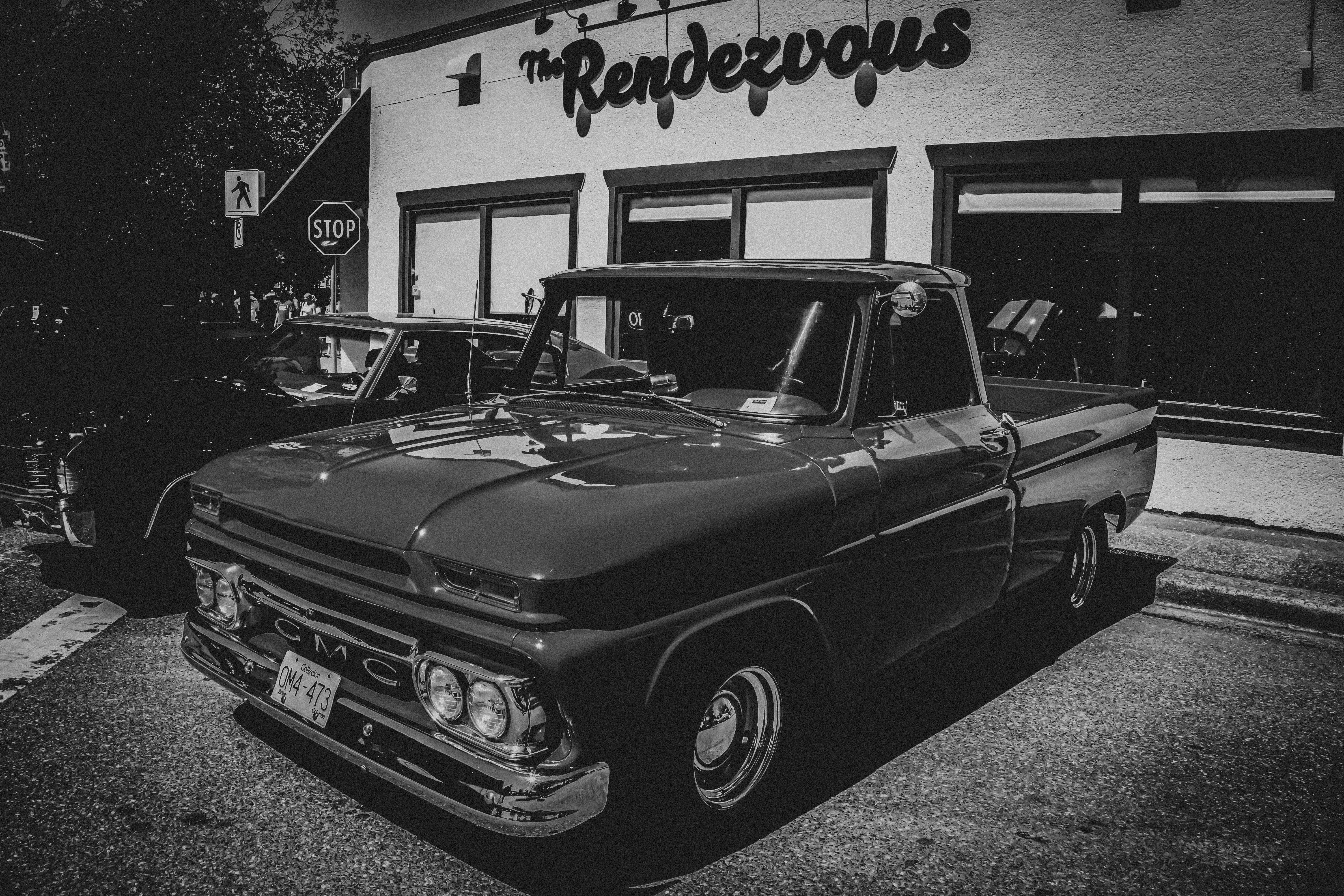 a black car parked in front of a building
