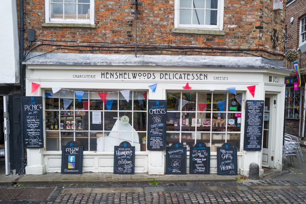 a store front with signs