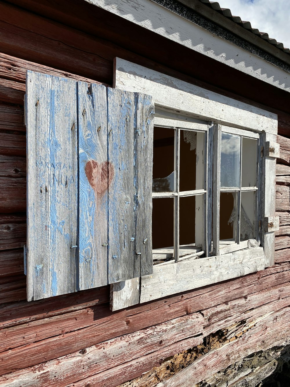 a window in a wooden building