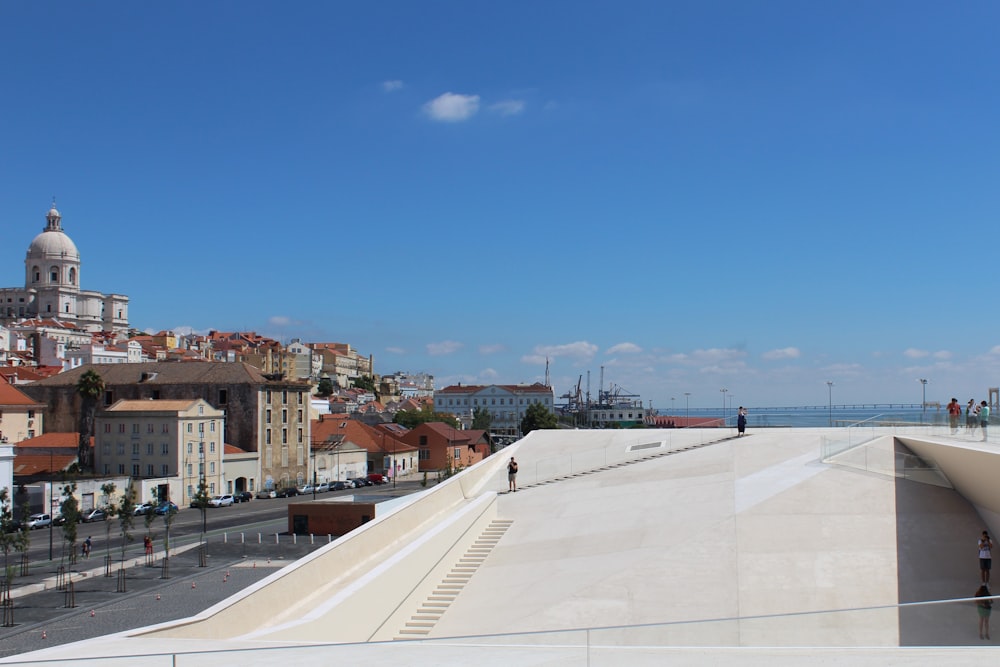 a large concrete area with buildings around it