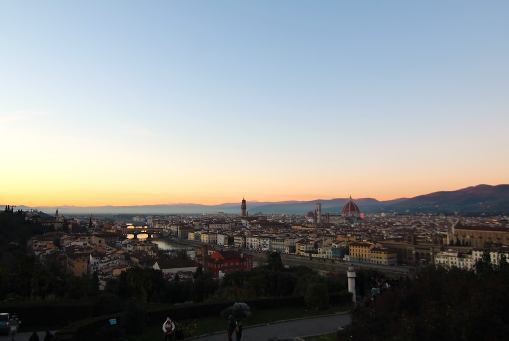 a city with a body of water in the background