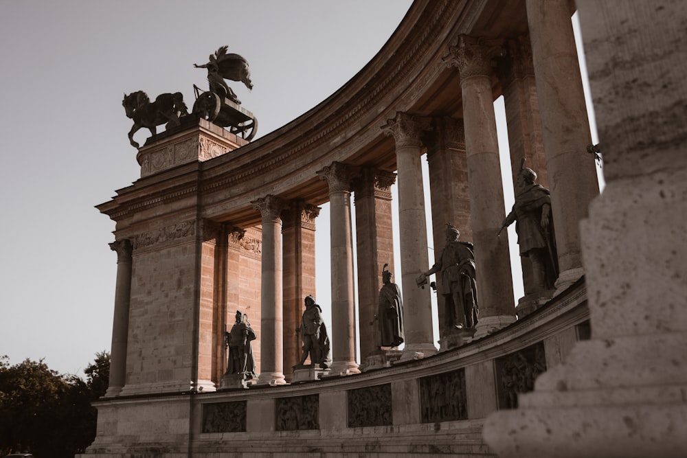 a building with statues on the front